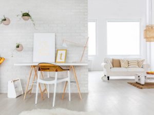 A white room with a table and chairs