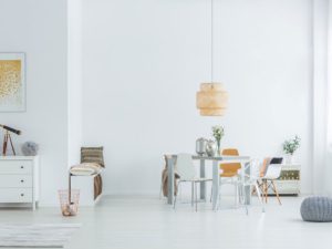 A white room with a table and chairs