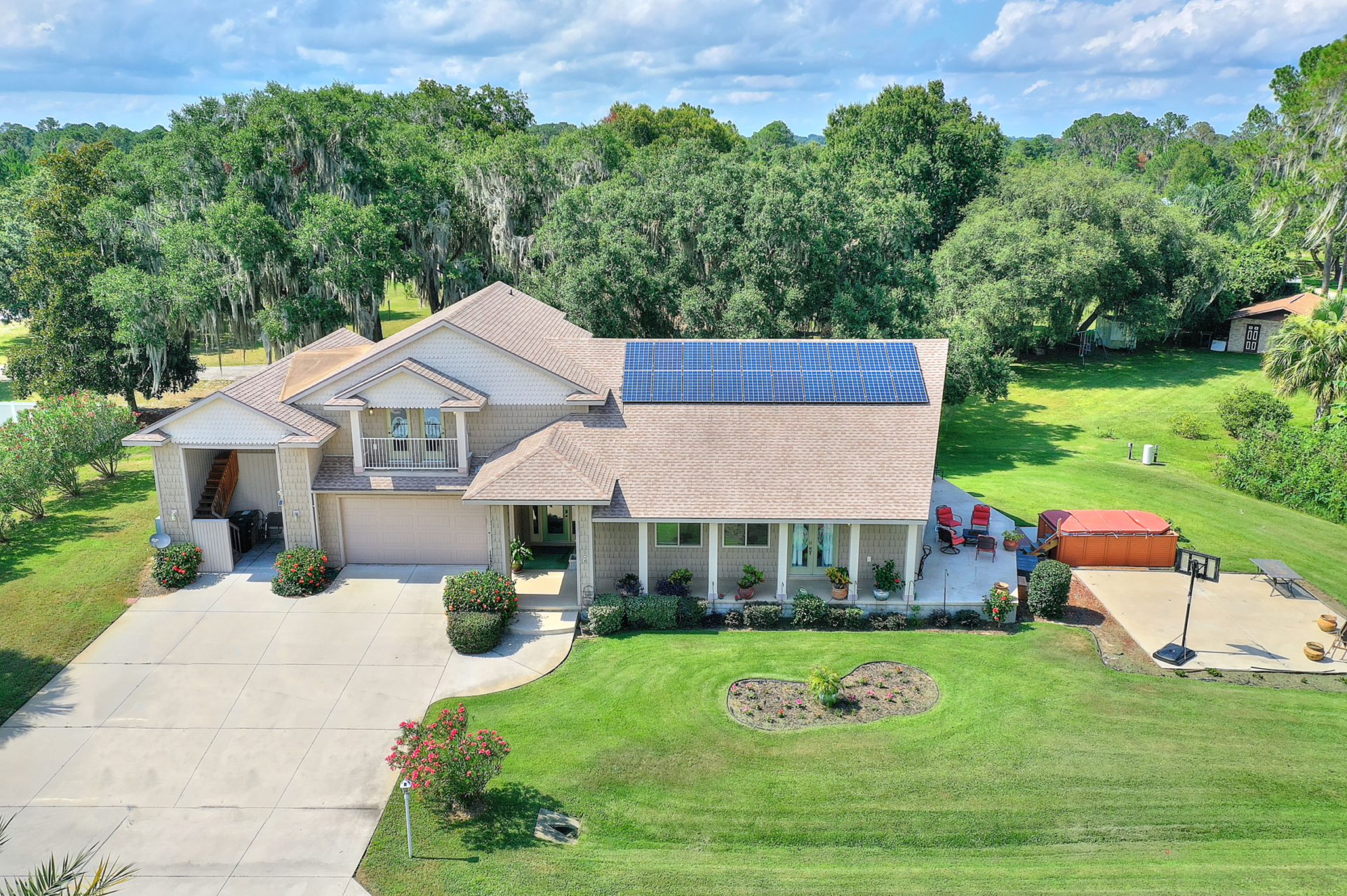 A house with a solar panel on the roof.