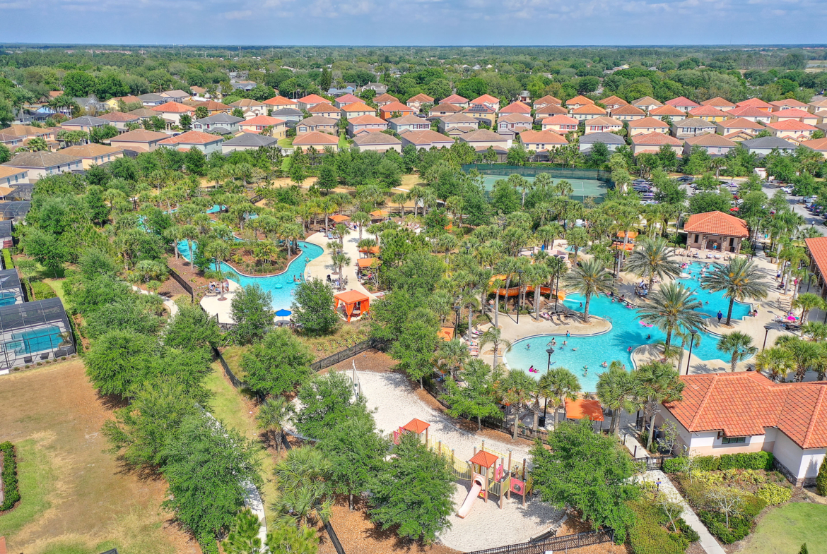 An aerial view of a resort with pools and water slides.