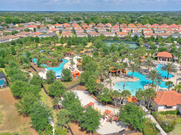 An aerial view of a resort with pools and water slides.