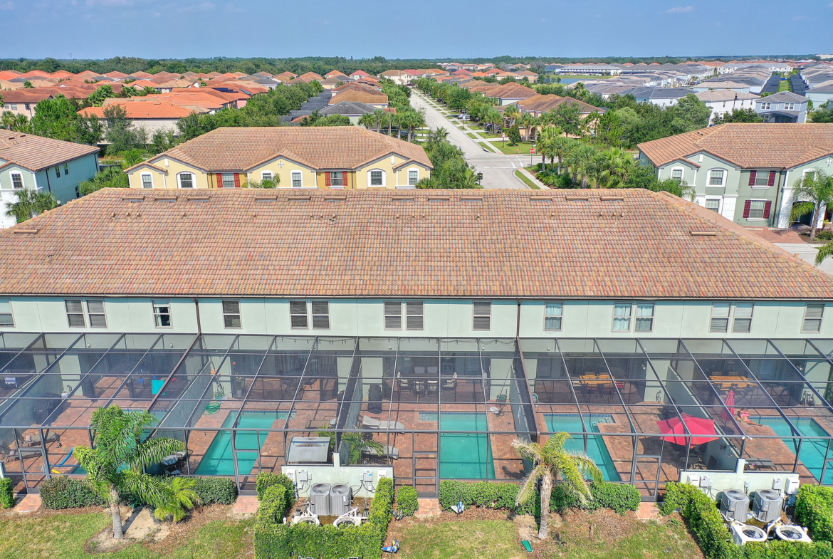 A large pool is in the middle of an aerial view.