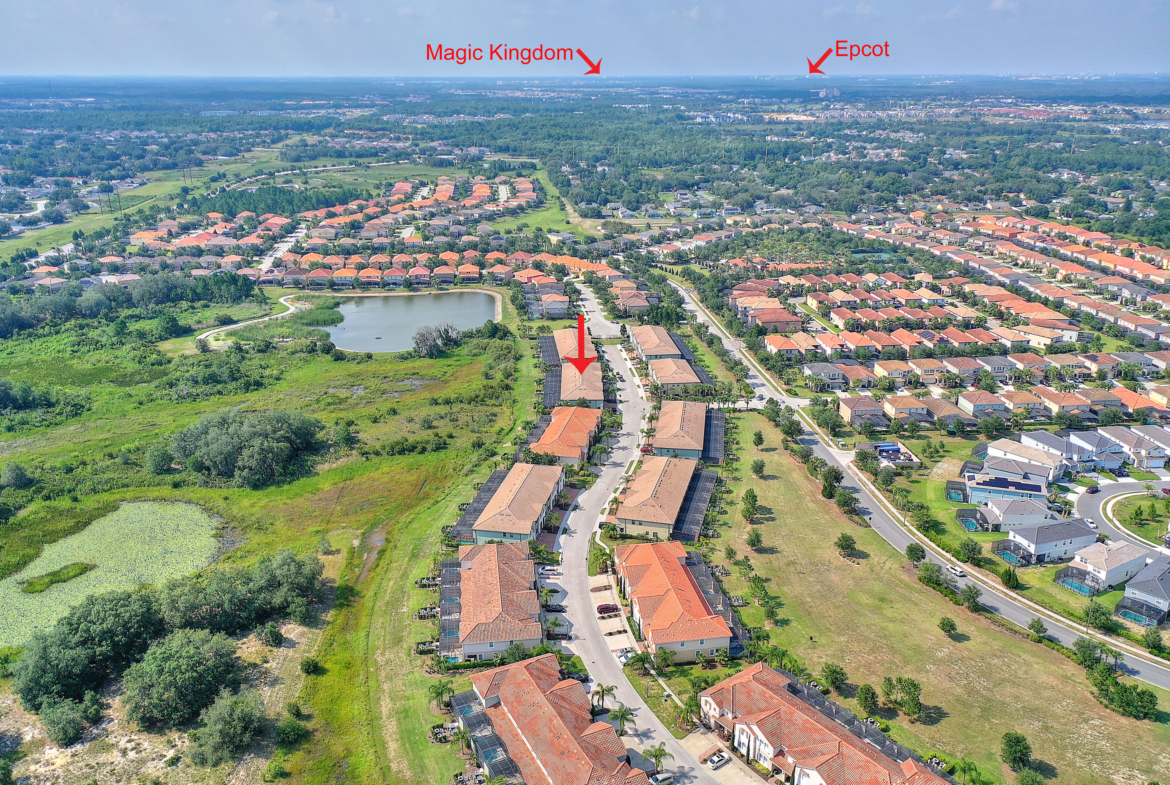 A bird 's eye view of the neighborhood with two red arrows pointing to the right.