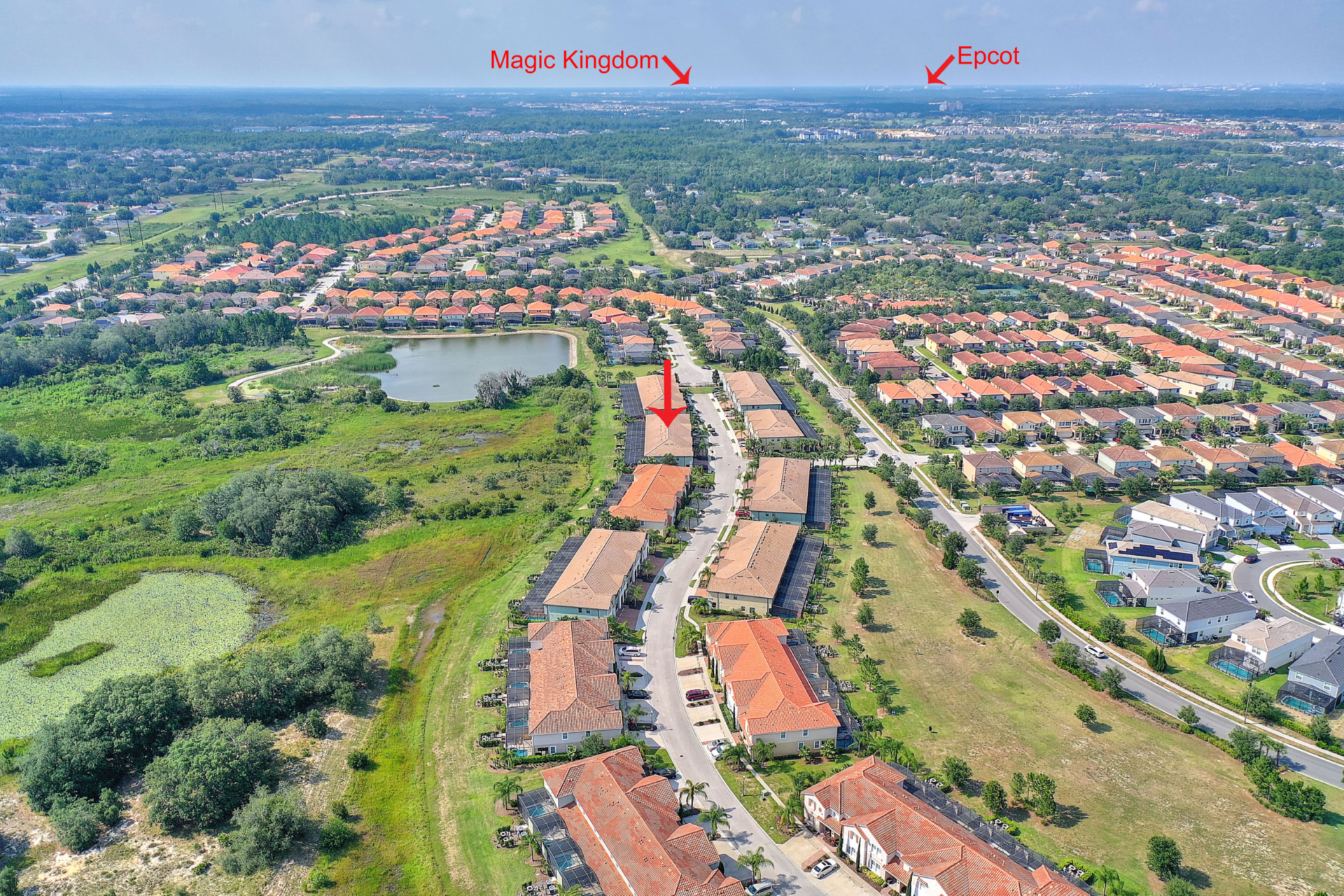 A bird 's eye view of the neighborhood with two red arrows pointing to the right.