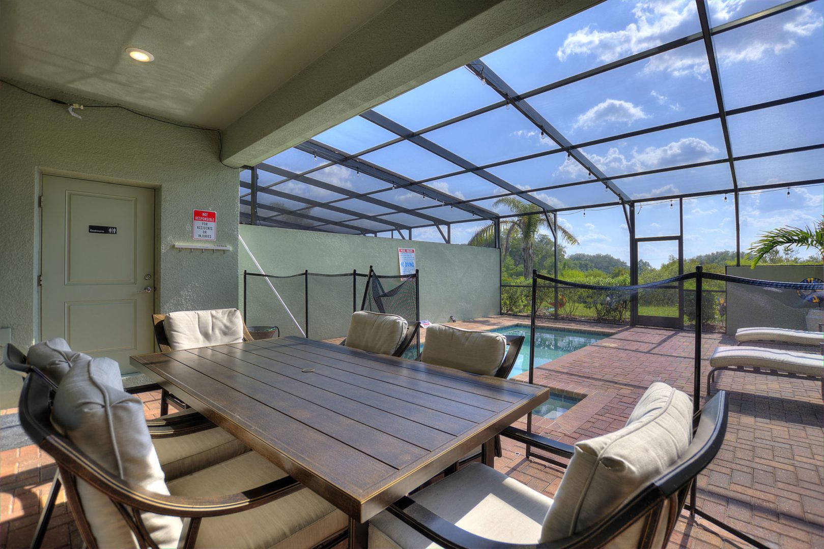 A table and chairs in the middle of an outdoor patio.