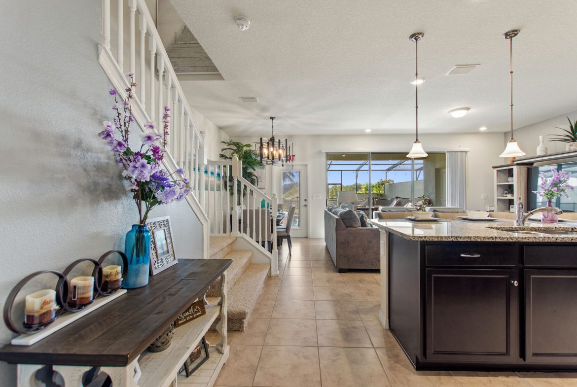 A large open floor plan with a kitchen and living room.