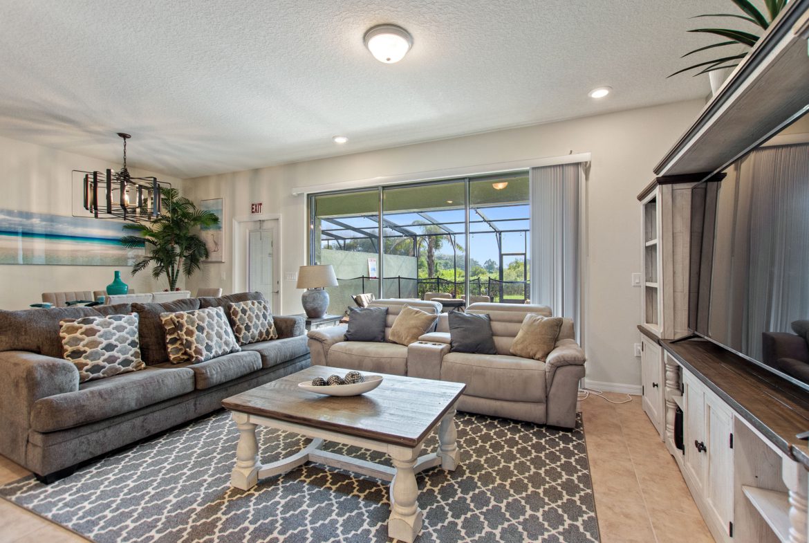 A living room with couches and tables in it