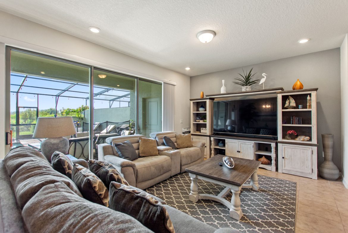 A living room with couches and a television.