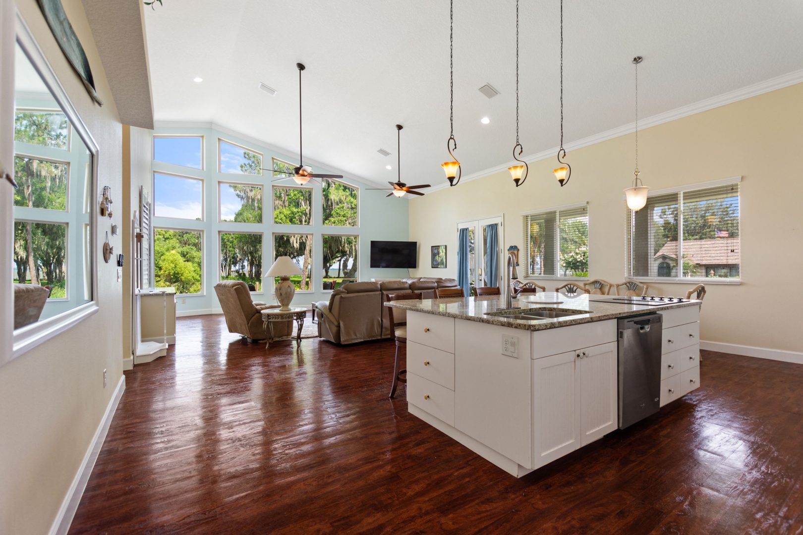 A large open kitchen with a dining room and living room.